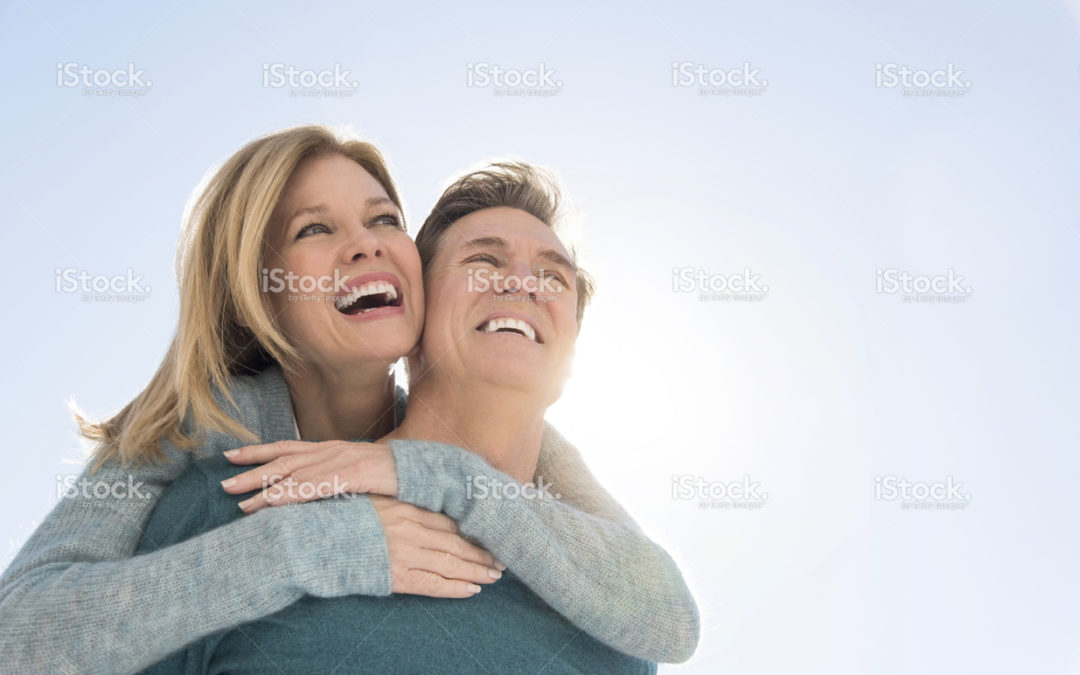 Smiling mature couple embracing outdoors